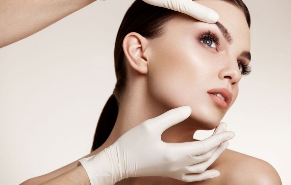 cosmetologists examine facial skin before rejuvenation